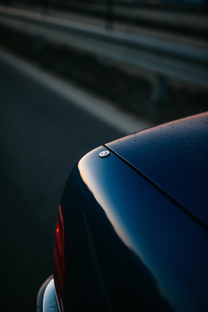 Free photo details of a car with the sunset sky reflecting in it