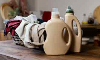 Free photo detergent bottles and clothes arrangement