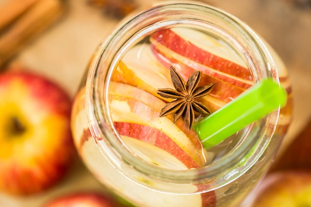 Free photo detox water with apples autumn composition with leaves and apples