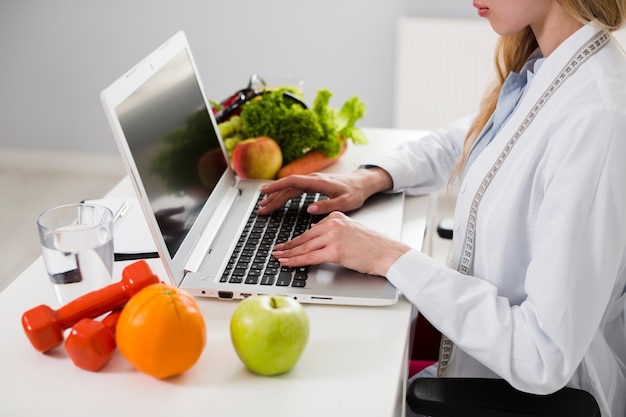 Diet concept with female scientist and healthy food