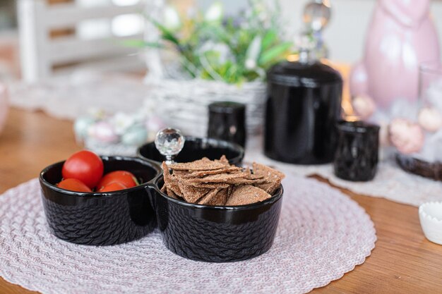 Different appetizers in the plates stands on the brown table in the kitchen