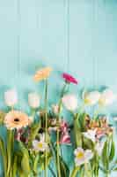 Free photo different bright flowers scattered on table