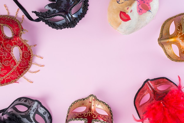 Different carnival masks on table 