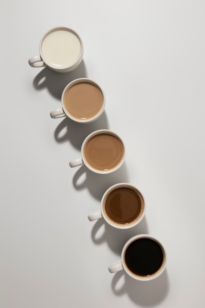 Free photo different coffee cups arrangement flat lay