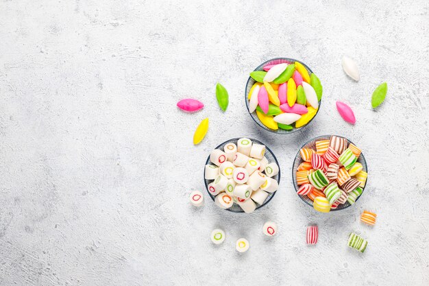 Different colorful sugar candies, top view