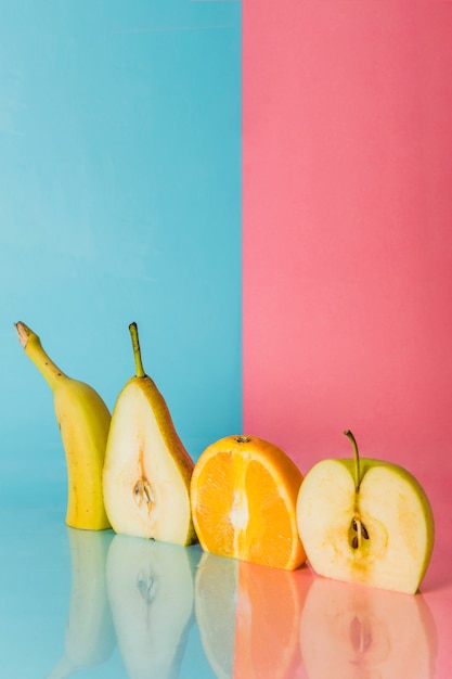 Free photo different fruits cut in half