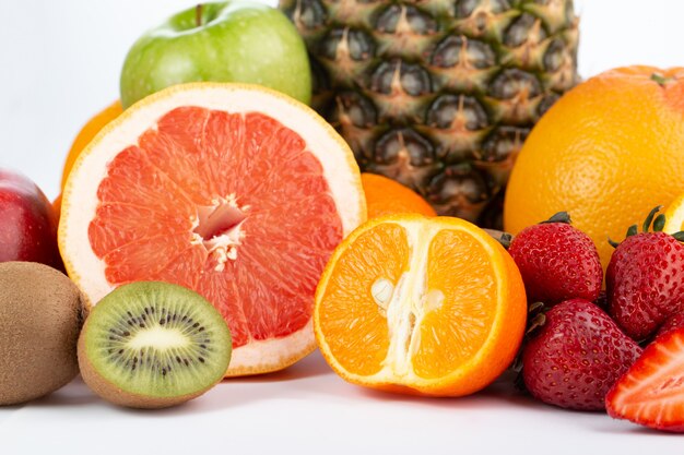 Different fruits vitamine riched fresh ripe mellow juicy isolated on white floor