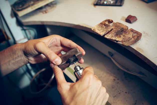 Free photo different goldsmiths tools on the jewelry workplace. jeweler at work in jewelry.