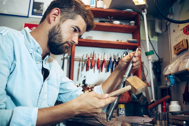 Free photo different goldsmiths tools on the jewelry workplace. jeweler at work in jewelry.