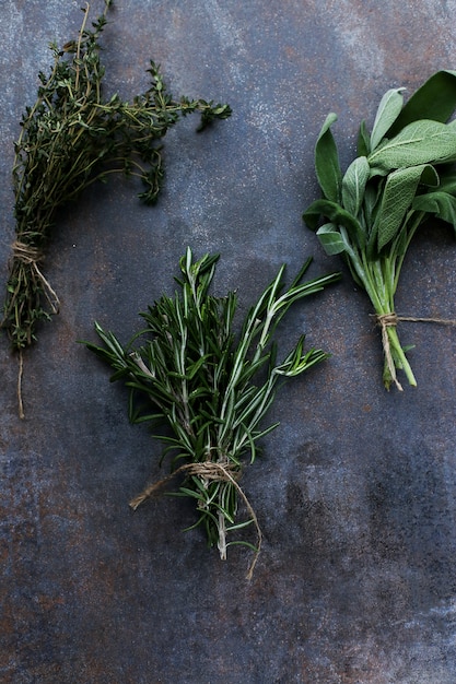 Free photo different herbs in black table, top view