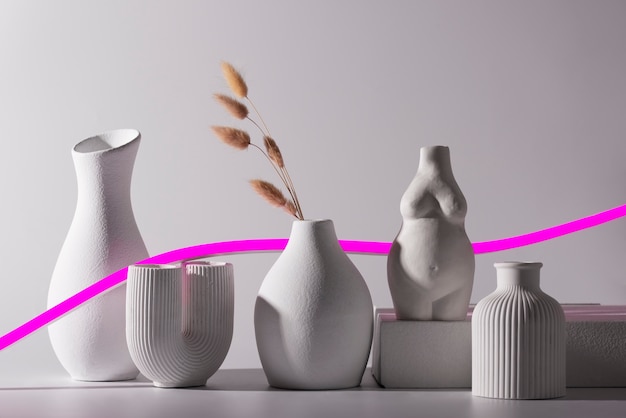 Free photo different modern vases and pink line