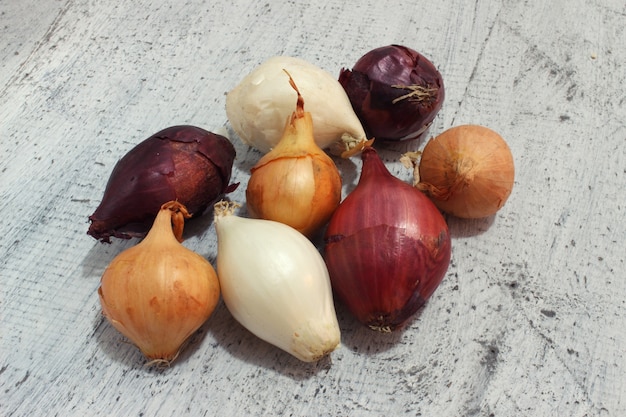 Different onions on wood