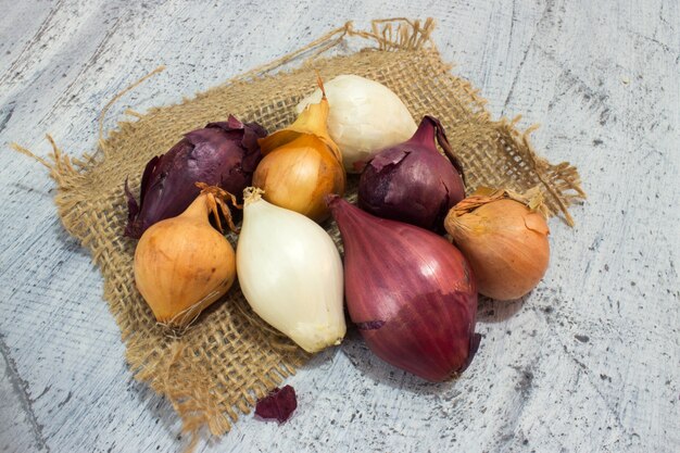 Different onions on wood