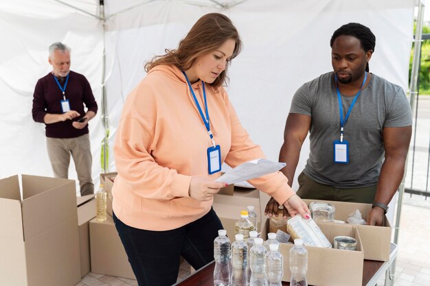 Different people doing volunteer work at a foodbank