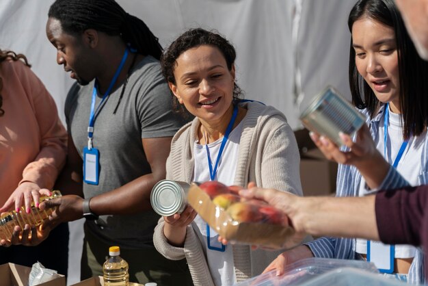 Different people doing volunteer work with food