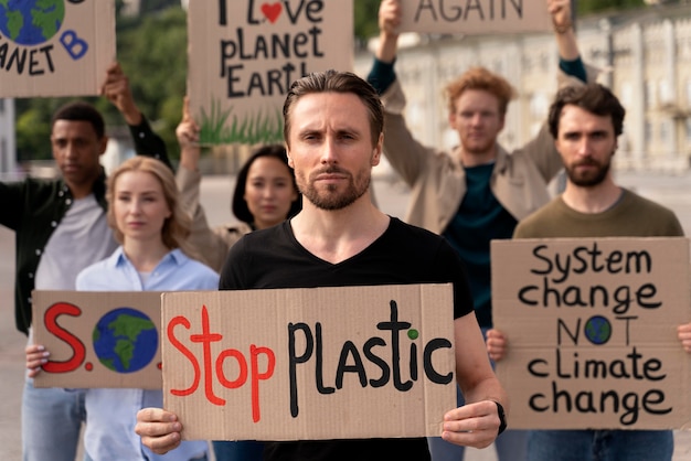 Free photo different people joining a global warming protest