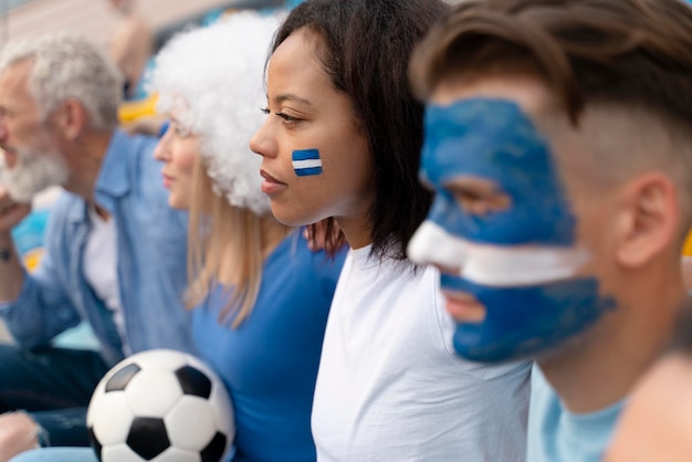 Free photo different people looking at a football team