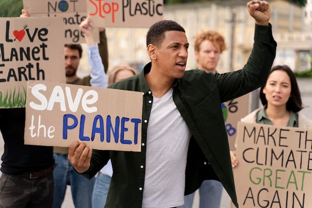 Free photo different people marching in climate change protest