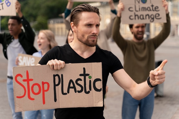 Free photo different people marching in global waring protest