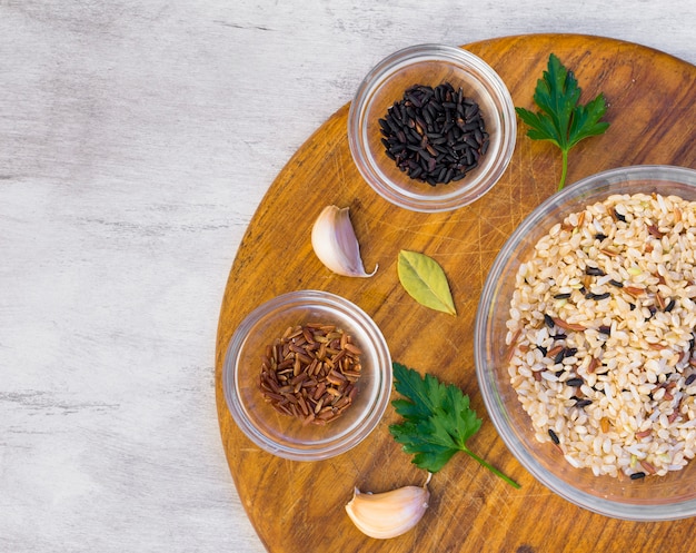 Free Photo different rice types in bowls on table 