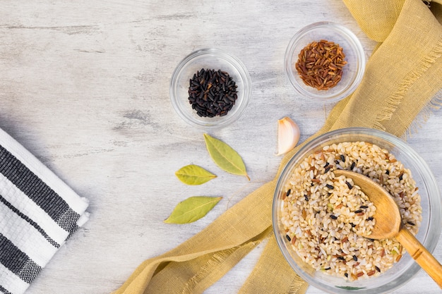 Free Photo different rice types in glass bowls on light table