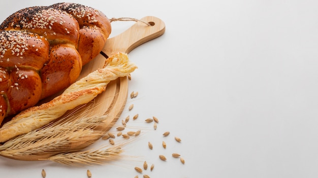 Different type of bread on wooden board