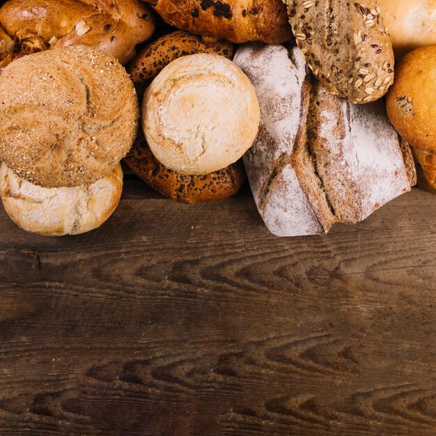 Different type of breads on wooden table