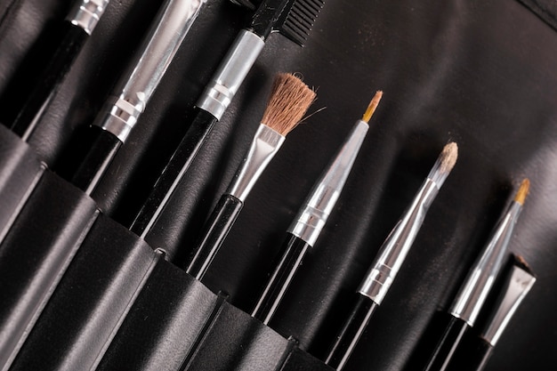 Free photo different type of makeup brushes in a row