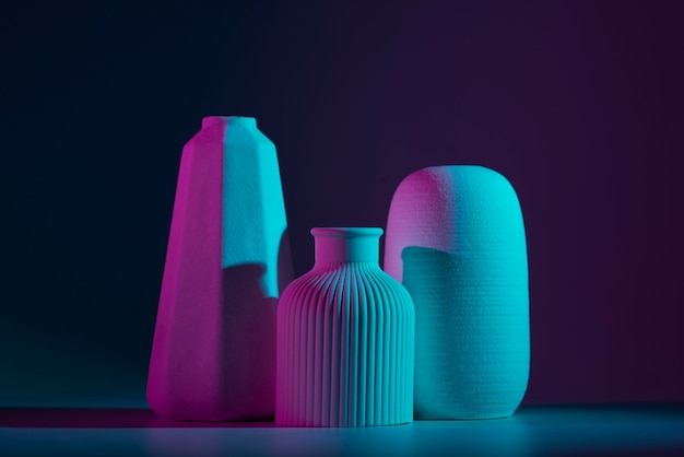 Different vases with blue and purple light