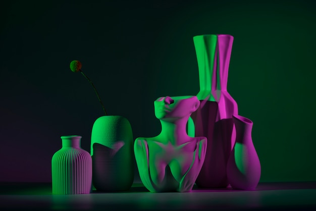 Different vases with green and pink light