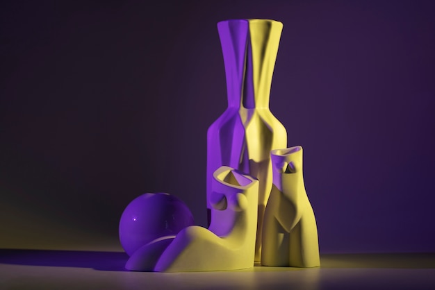 Free Photo different vases with purple and yellow light arrangement