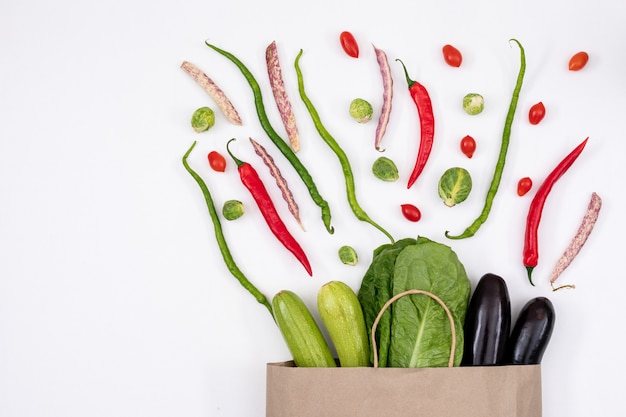 Different vegetables near paper bag