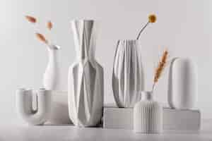 Free photo different white modern vases arrangement