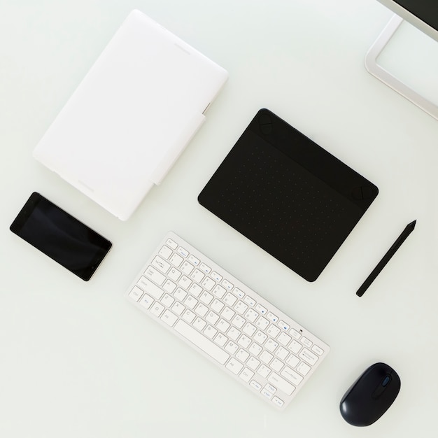 Free Photo digital devices lying on table