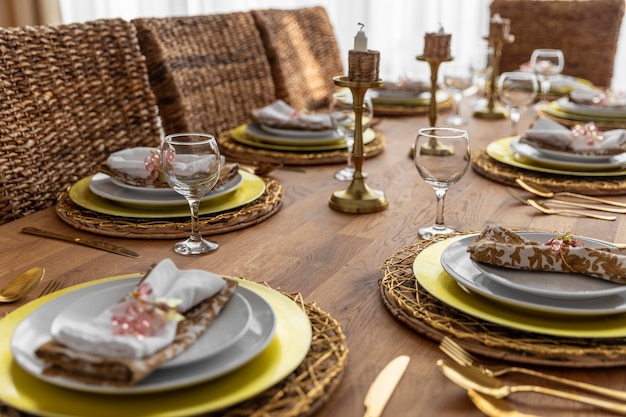 Free photo dining table with plates arrangement