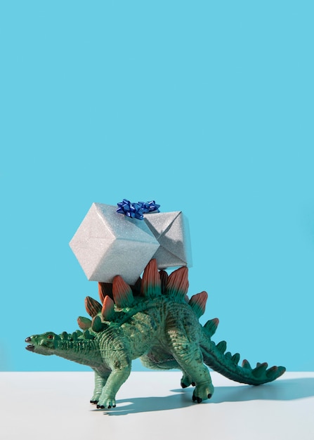 Free Photo dinosaur toy wearing gifts