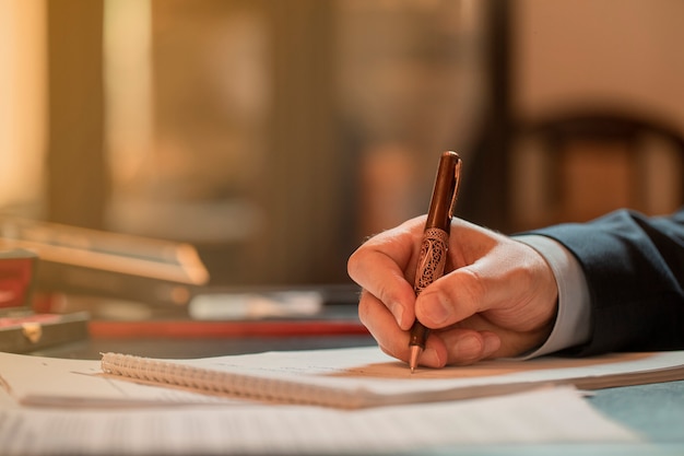 Director signing documents with a fashion pen. High quality photo