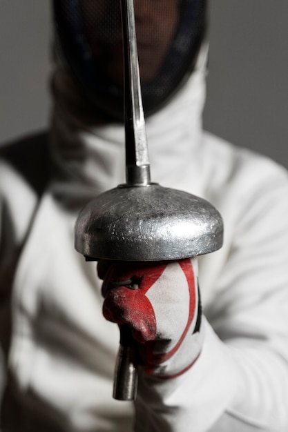 Free Photo disabled fencer in special equipment sitting in a wheelchair