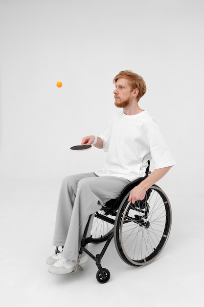 Disabled ping pong player in a wheelchair