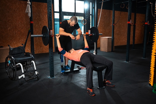 Free Photo disabled woman training in the gym of rehabilitation center