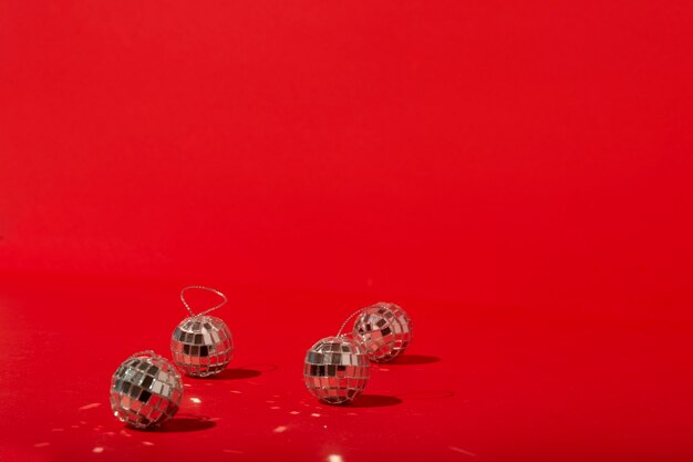 Disco balls on red table