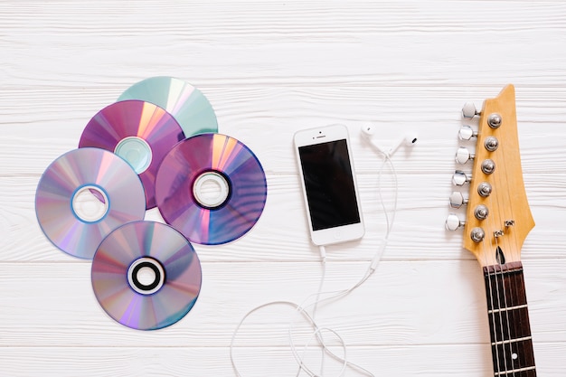 Free Photo discs, guitar and smartphone