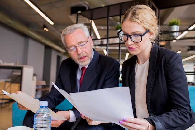 Discussion of a new business plan by businessman and businesswoman