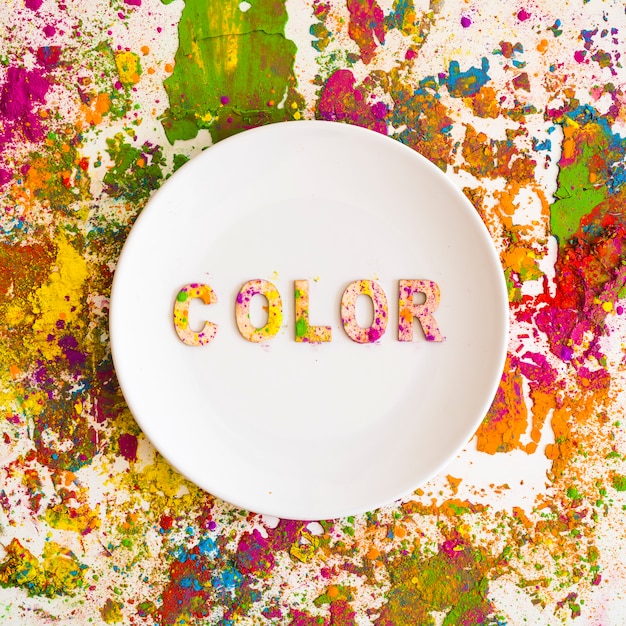 Free photo dish with color inscription on bright dry colours