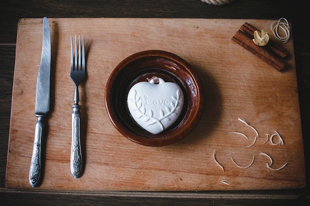 Free Photo dish with cutlery and a heart shape inside