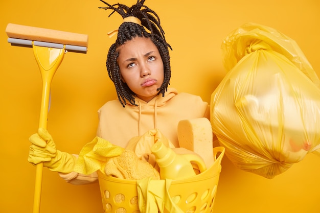 Free photo displeased afro american woman has combed dreadlocks looks sadly