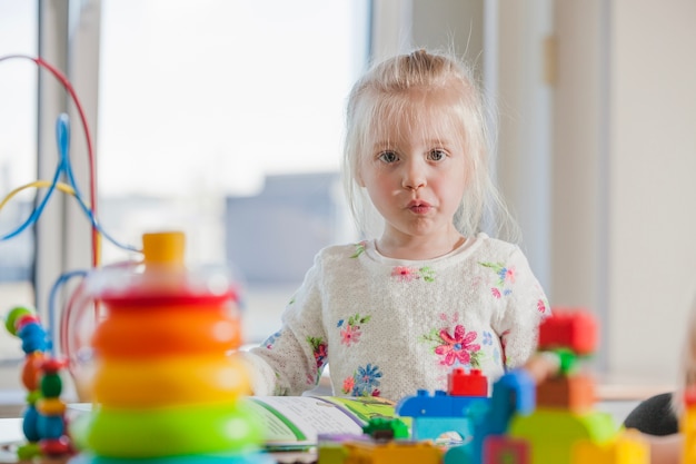 Displeased kindergarten girl