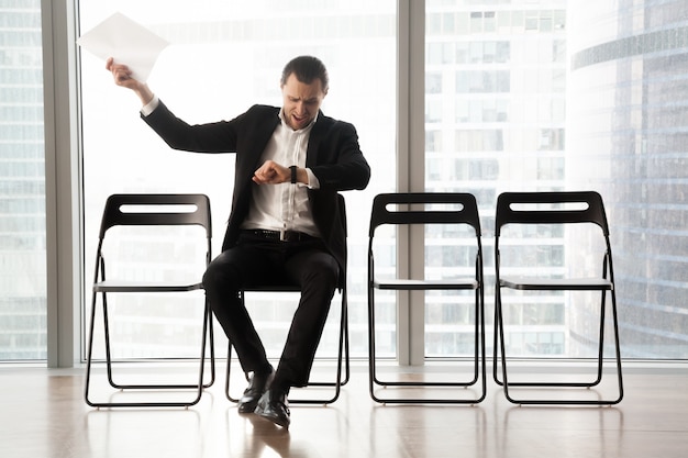 Distraught impatient businessman yelling in anger 