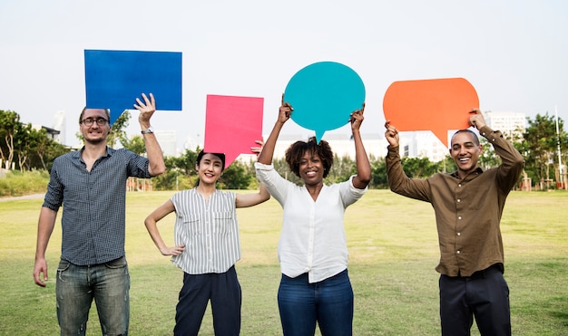 Free Photo diverse friends holding speech bubbles