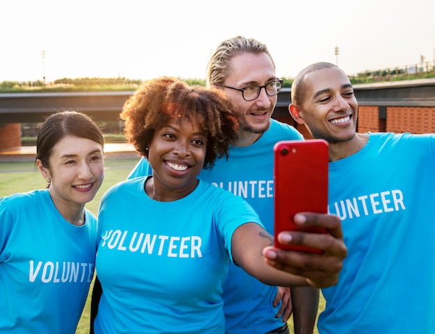 Diverse volunteers taking a selfie together